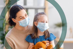 mom and daughter wearing masks
