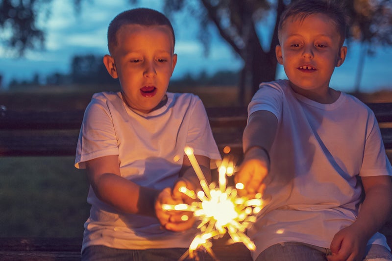 Children playing with sparklers