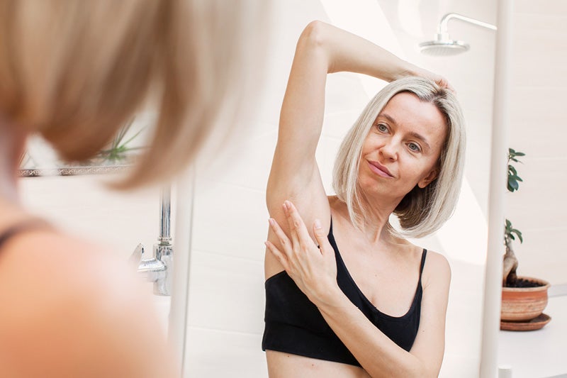 woman doing a self-breast exam