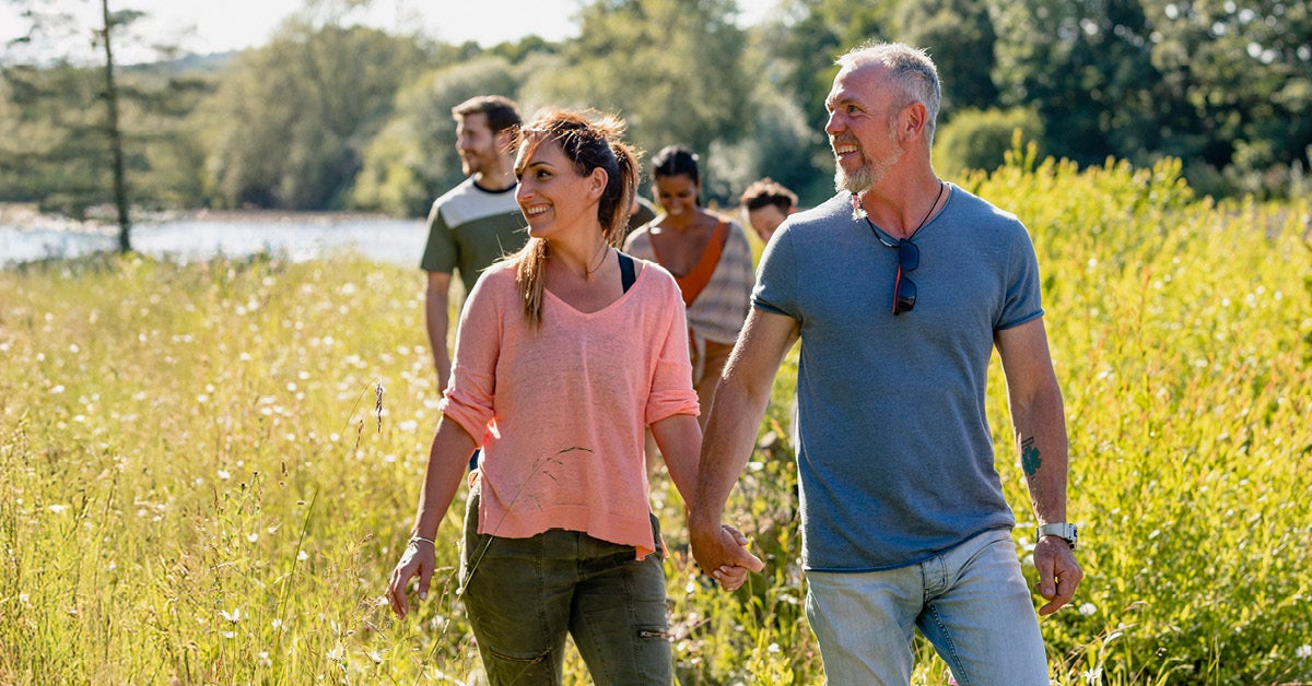 couple out walking in field