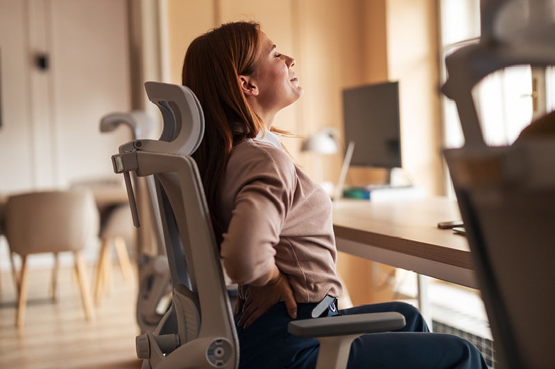 Woman holder her back