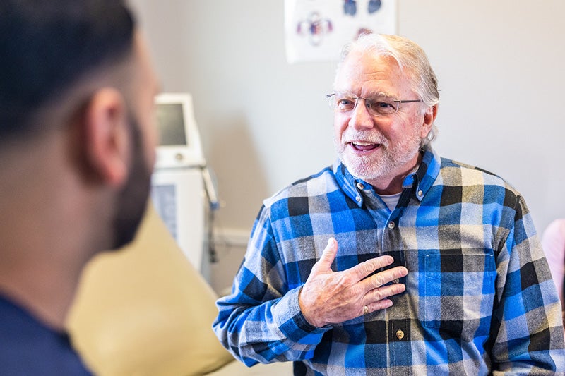 Man holding his chest