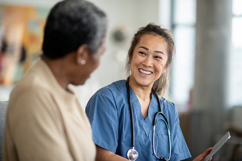 Nurse smiling at skilled nursing patient