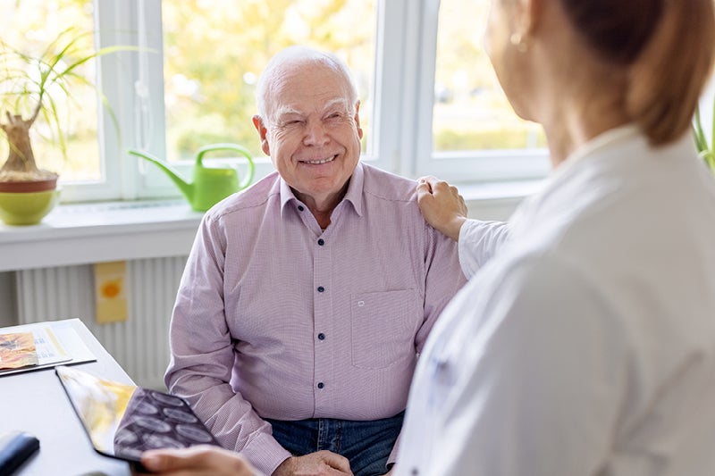 Older man talking to a doctor