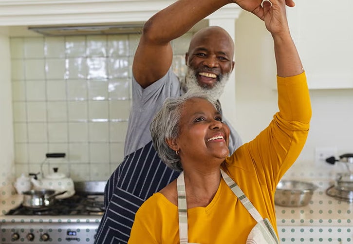 Couple dances in kitchen