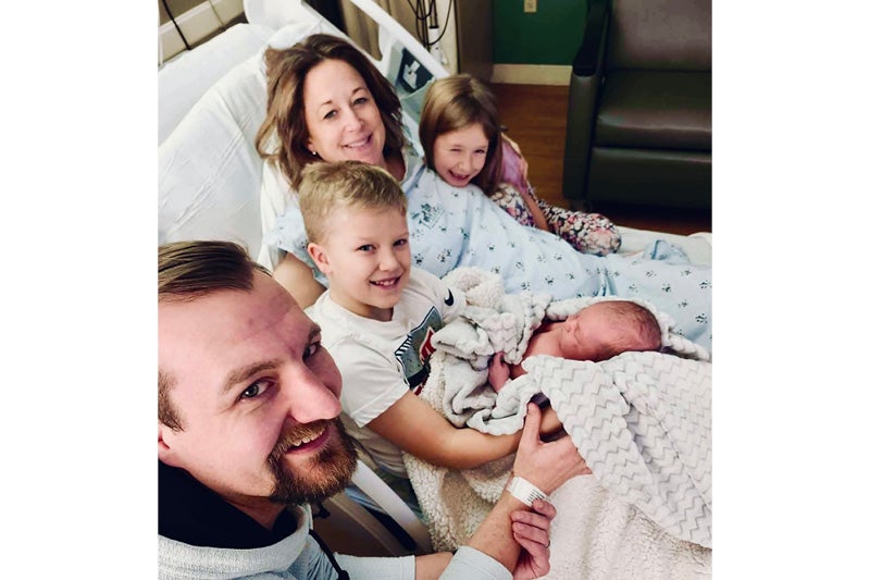 photo of family in hospital bed
