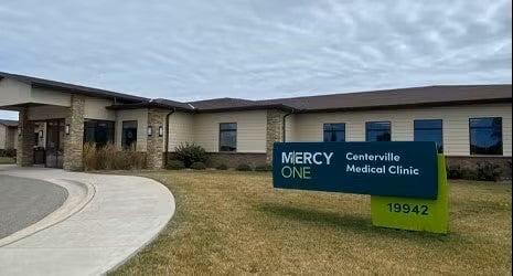 MercyOne Centerville Medical Clinic building with a sign by the driveway.