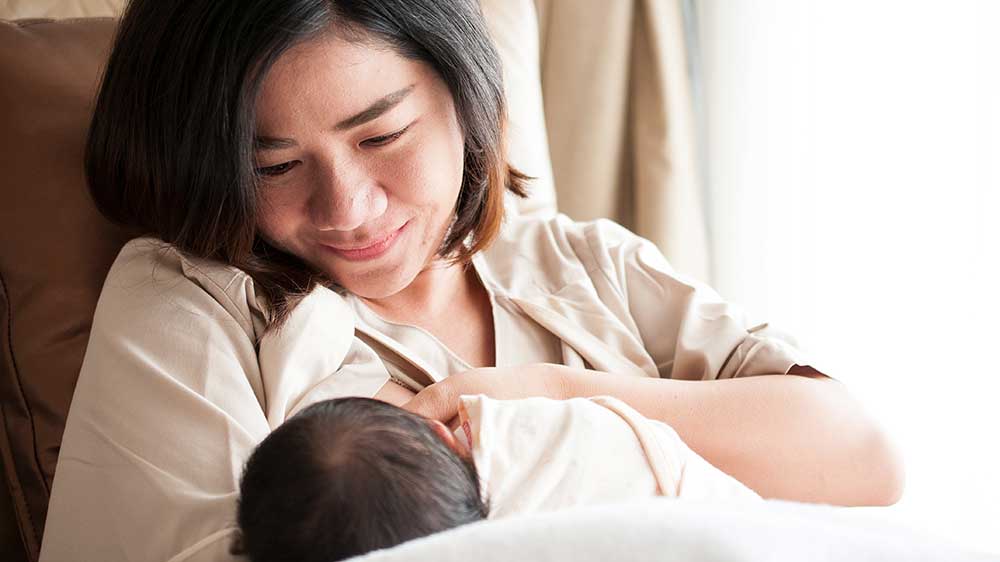 mom breastfeeding baby