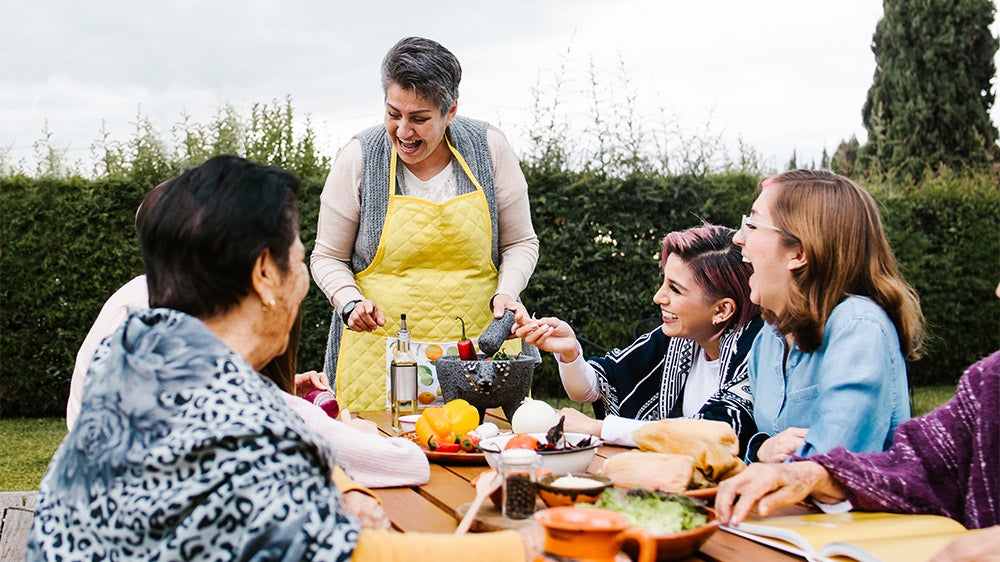 hispanic multigenerational family having dinnere