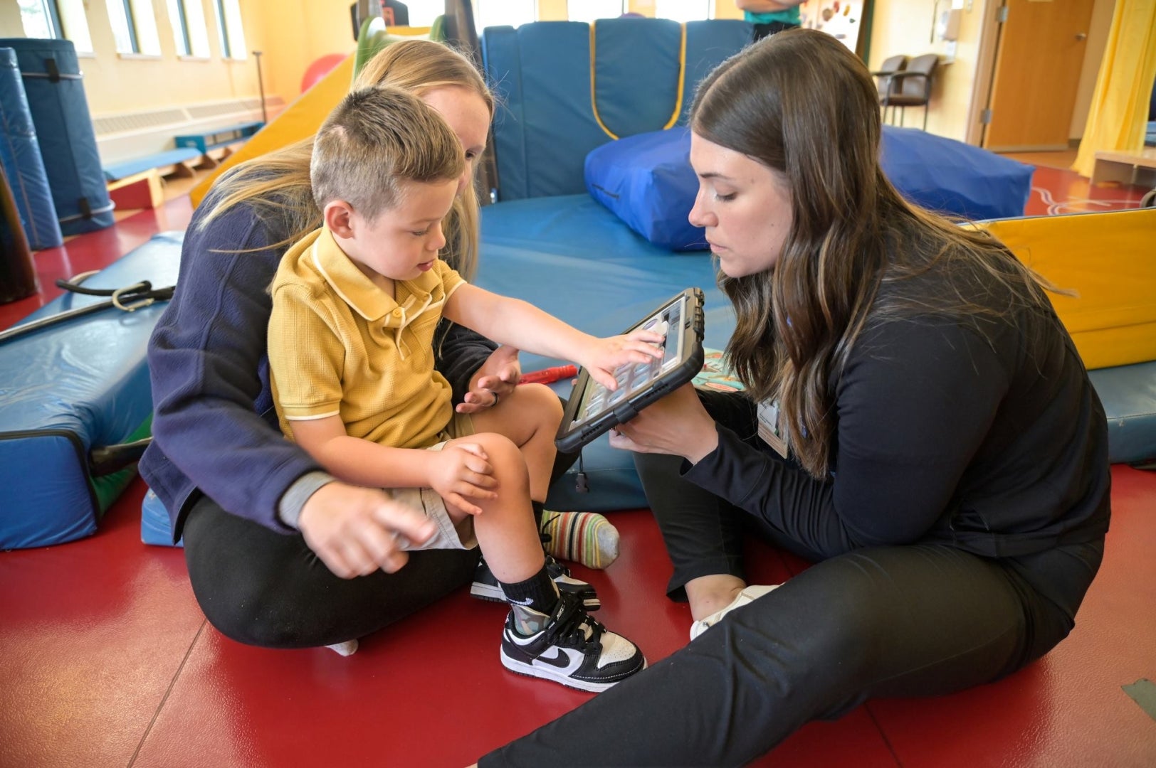 Pediatric therapists working with child