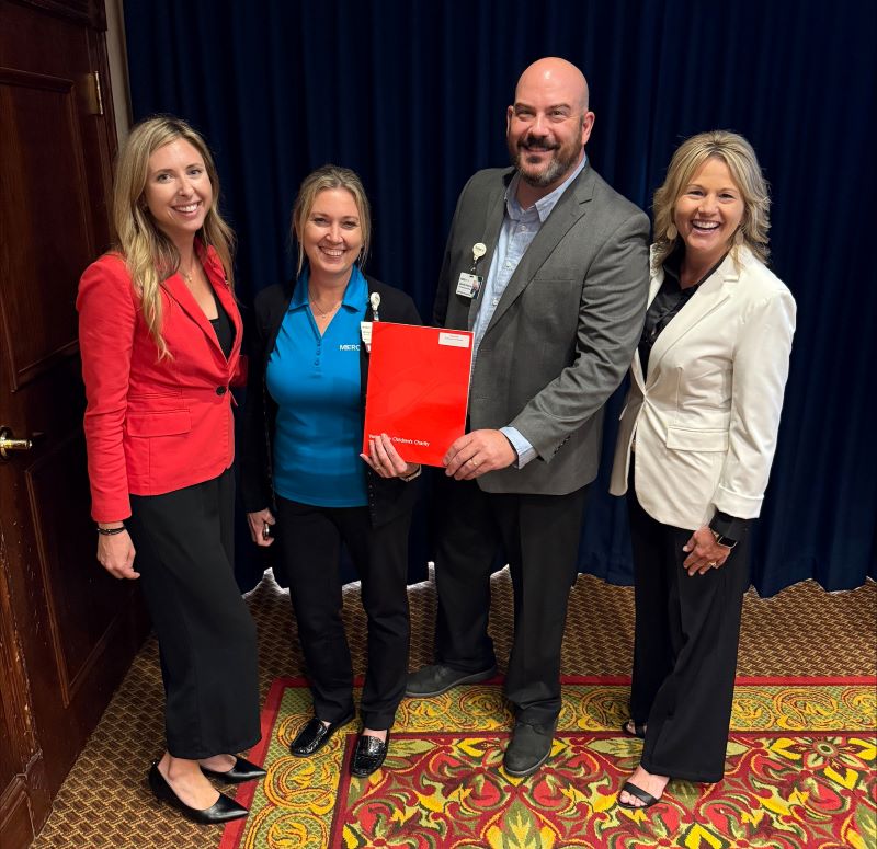 Representatives from MercyOne and Variety - The Children's Charity pose for a photo.