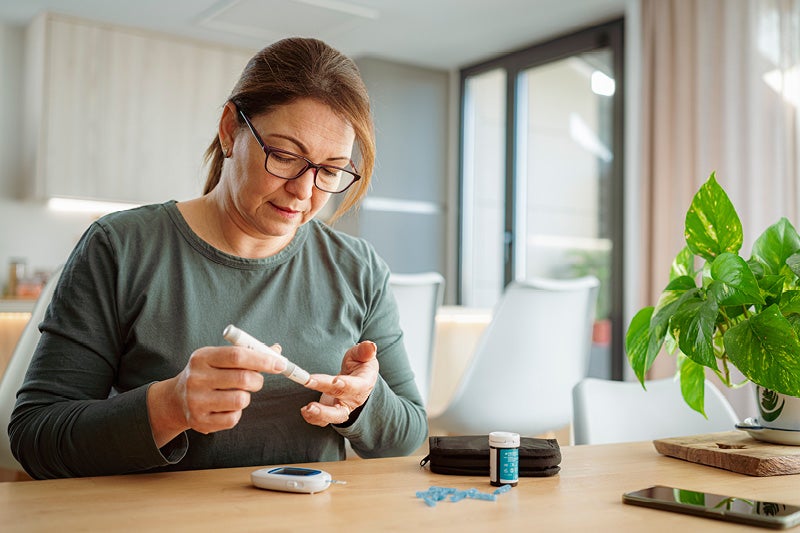 Women checking her blood sugar