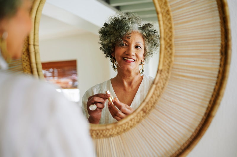Woman admiring herself in the mirror