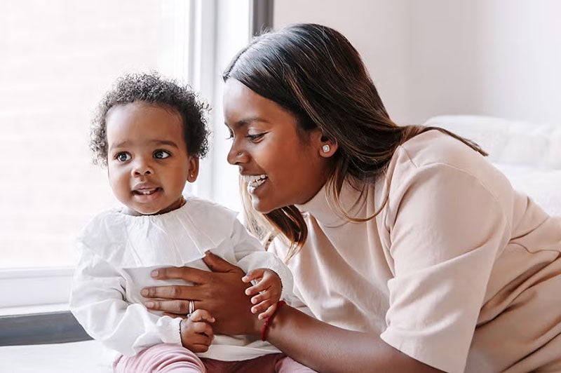 new mother holding infant